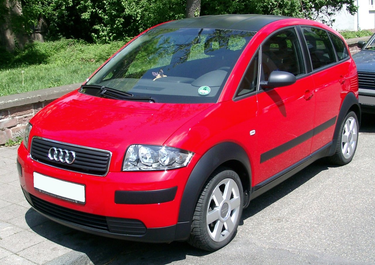 Front three-quarter view of a red Audi A2 with black roof and wheel-arch trim