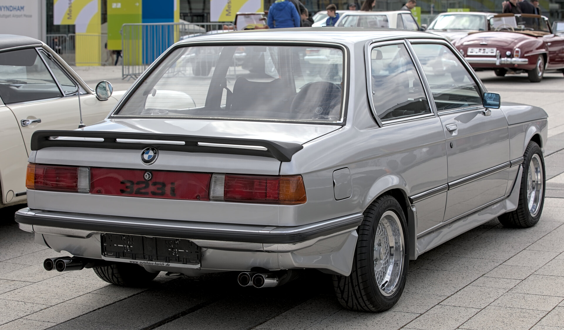 Rear three-quarter view of a silver BMW 323i from the E21 generation