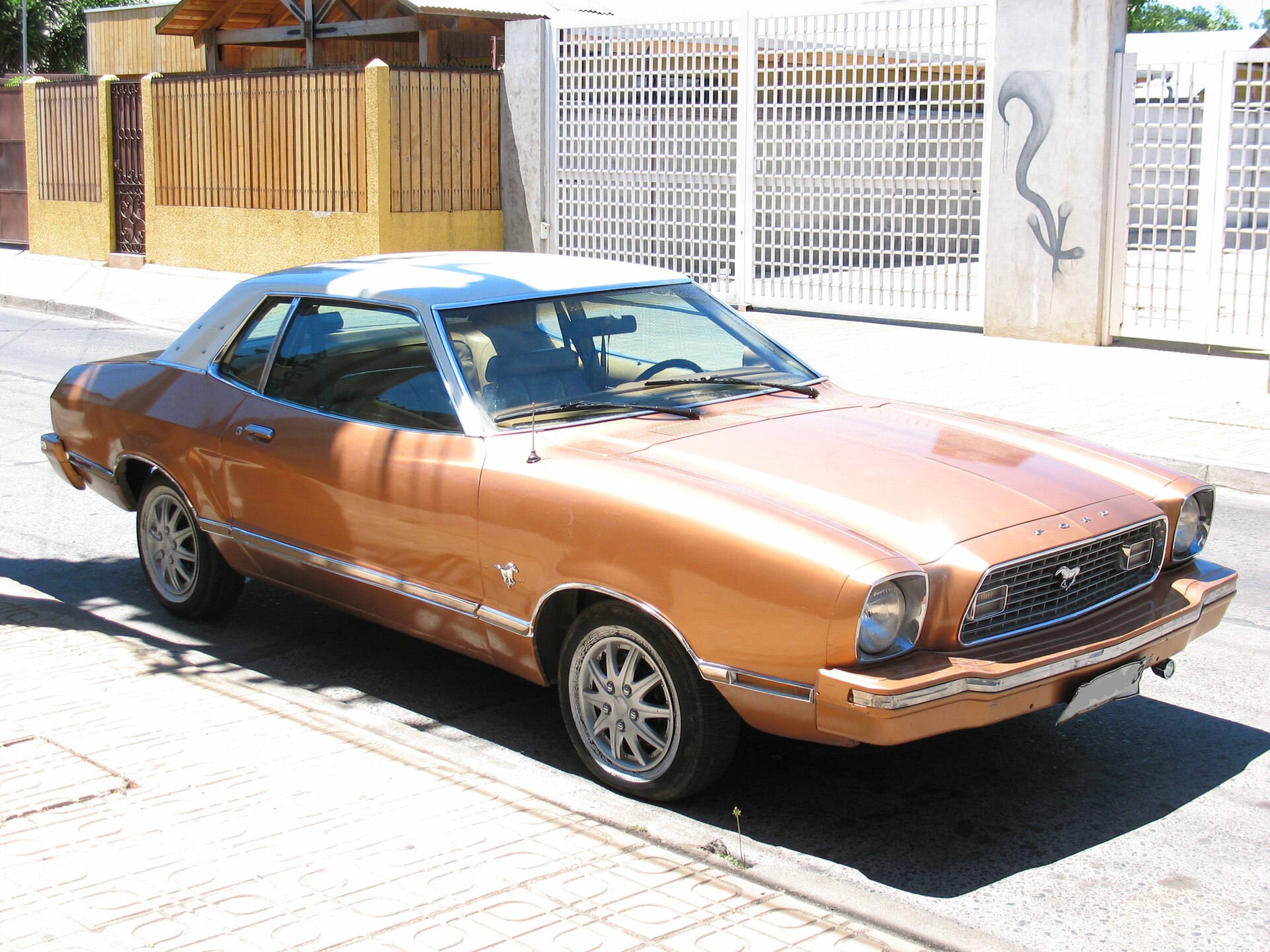 Front three-quarter view of a bronze 1974 Ford Mustang II coupe