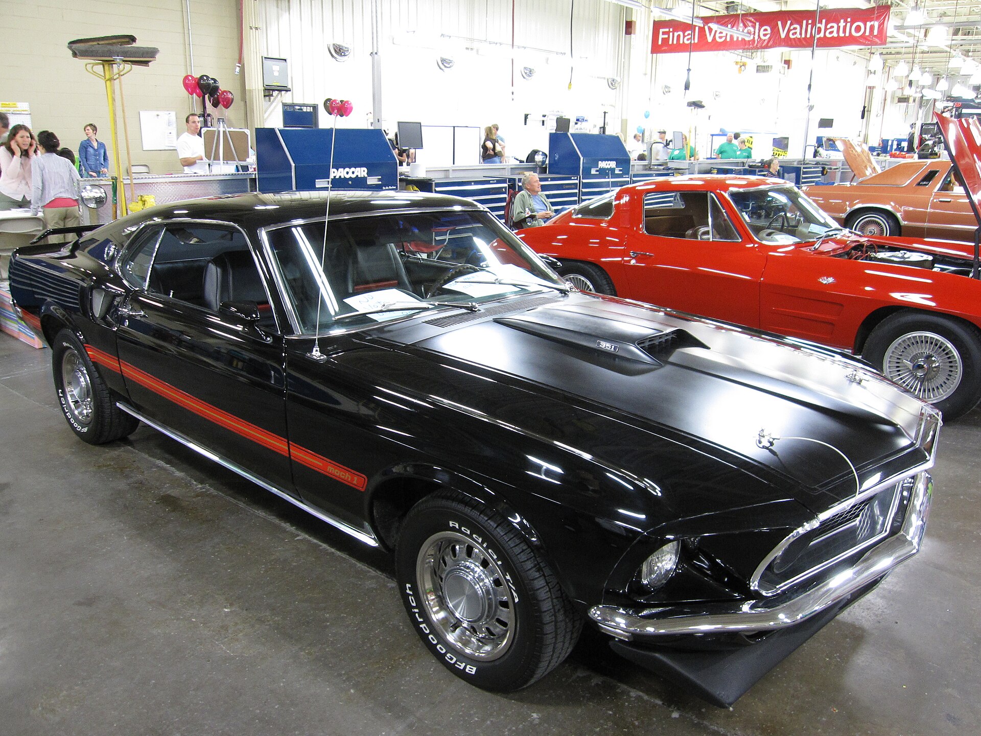 Front three-quarter view of a black 1969 Ford Mustang Mach 1 SportsRoof