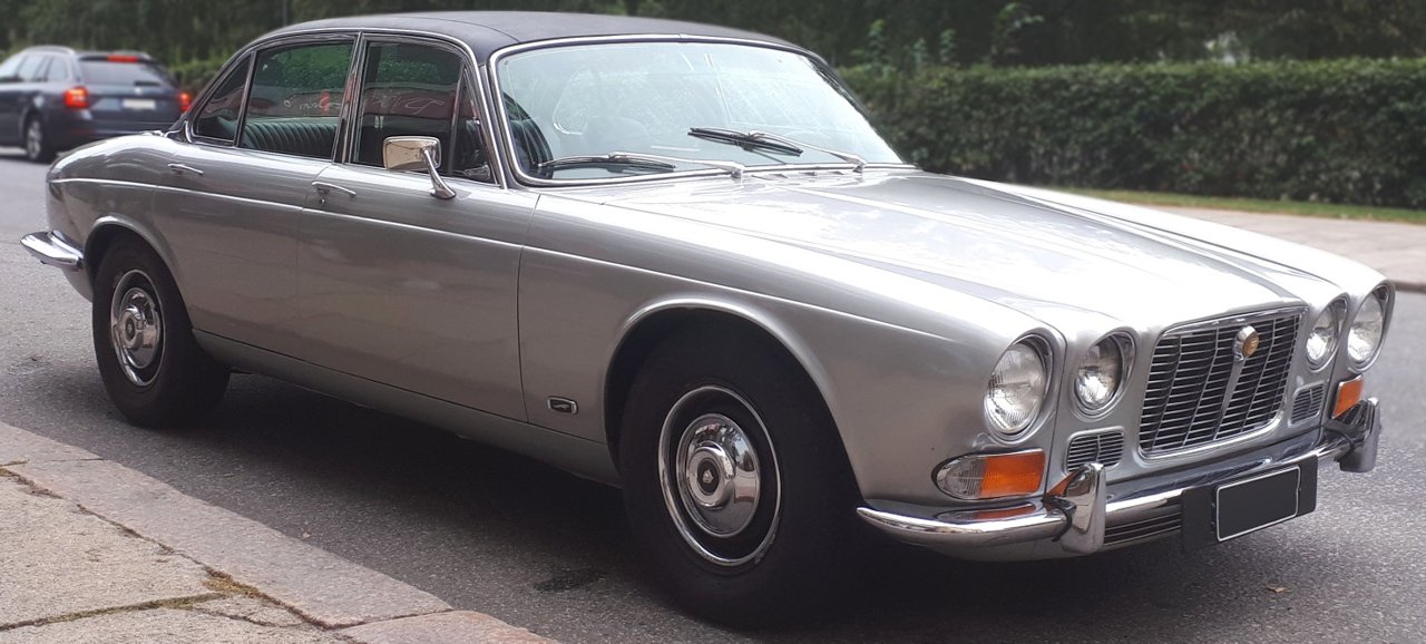 Silver Jaguar XJ6 Series 1 four-door saloon viewed from the front and side