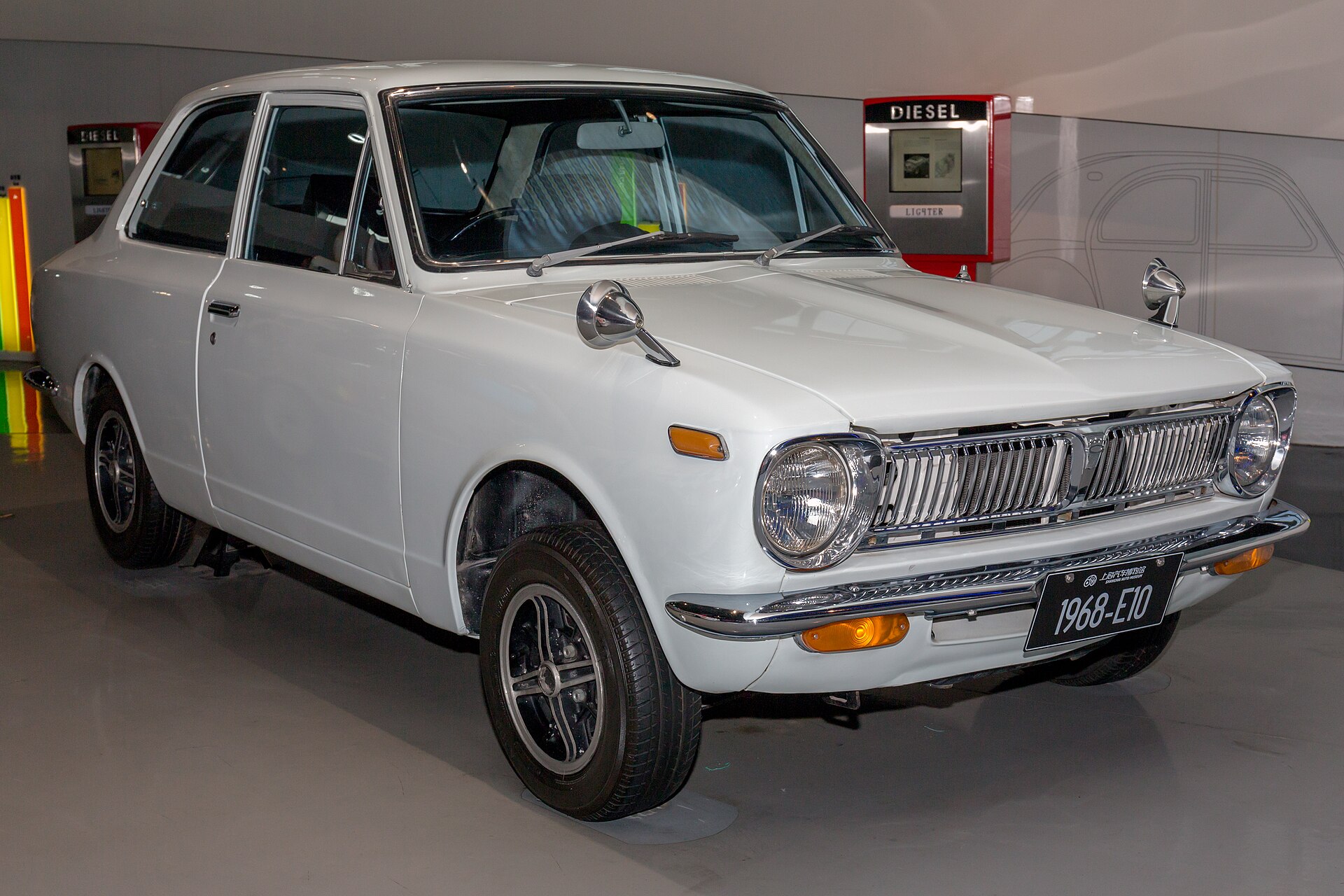 Front three-quarter view of a white 1968 Toyota Corolla E10 two-door saloon