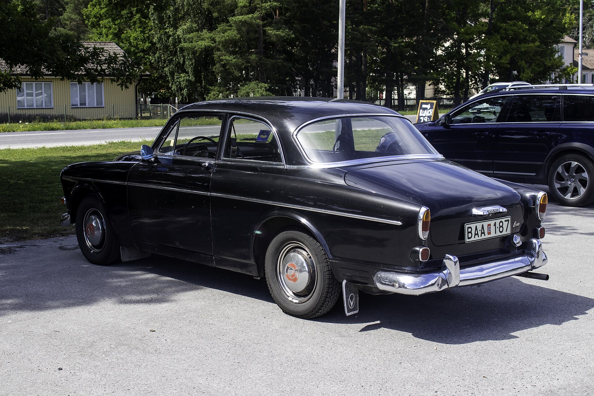 Rear three-quarter view of a black two-door Volvo Amazon